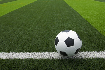 soccer ball or football on soccer field