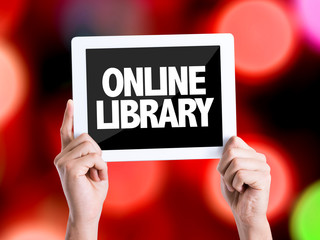 Tablet pc with text Online Library with bokeh background