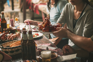 Closeup of crab served on table with people in background