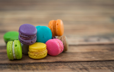 French colorful macarons on wood table