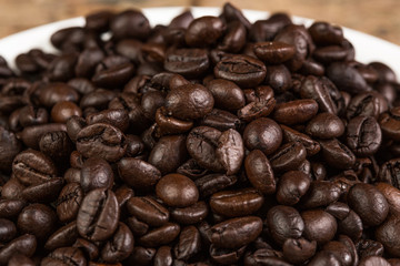 Coffee bean on grunge wooden background