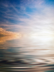 Naklejka na ściany i meble Reflections of sunset in lake water