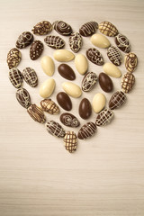 Chocolate Easter Eggs Over Wooden Background