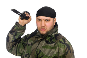 Young man in soldier uniform holding knife isolated on white