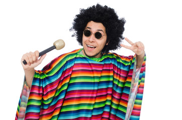 Funny mexican wearing poncho with maracas isolated on white