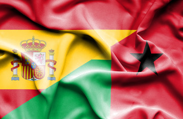 Waving flag of Guinea Bissau and Spain