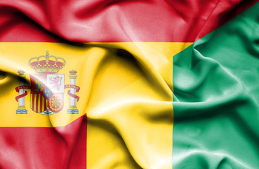 Waving flag of Guinea and Spain