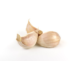 Three garlic cloves isolated on white background