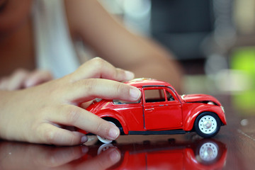 Favorite toy / A child playing his favorite toy car