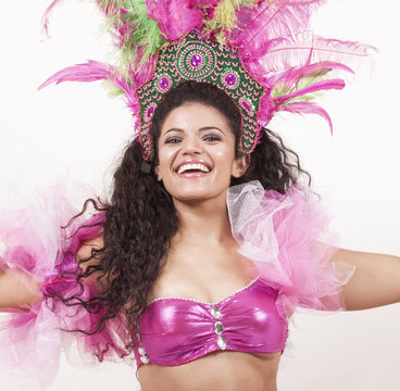 Gorgeous samba dancer wearing traditional pink costume