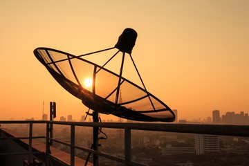 Satellite Dish on the Roof at Sunrise.