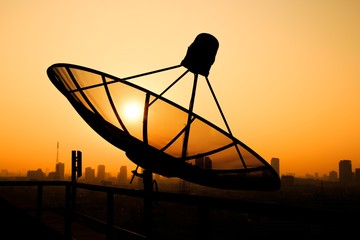 Satellite Dish on the Roof at Sunrise.