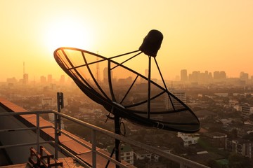 Satellite Dish on the Roof at Sunrise.