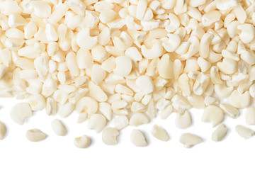 food background of raw white corn grits, tilt shift lens