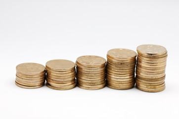 Stacks of coins on white background