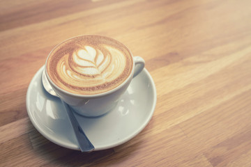 cup of coffee with leaves pattern