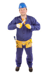 Worker in protective helmet with instruments.