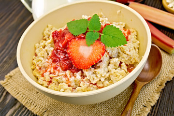 Oatmeal with strawberry-rhubarb sauce on board