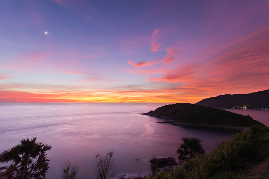 Beautiful sunset in promthep cape is a mountain of rock that extends into the sea in Phuket, Thailand