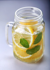 a glass of fresh lemon infused water
