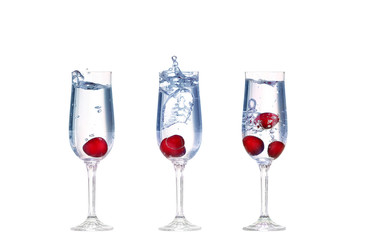 cherry splash in a cocktail glass on white