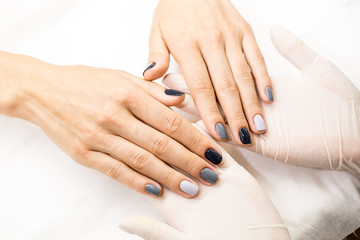 Obraz na płótnie Canvas Photo close-up of a beautiful stylish manicure with multicolored