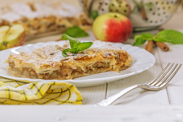 Tart of puff pastry with apples, close up