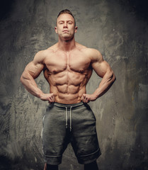 Handsome muscular bodybuilder posing