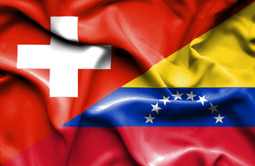 Waving flag of Venezuela and Switzerland