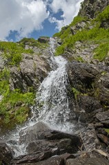 Fototapeta na wymiar Close up mountain waterfall in Carpathians mountains 