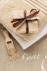 Bar of handmade soap and scoop of sea salt