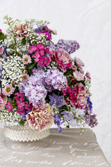 Bouquet of carnations, lilacs and chrysanthemums
