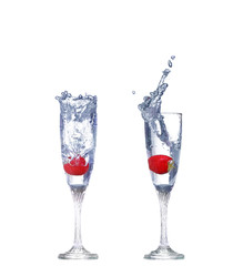 collage  Strawberry splash in a cocktail glass on white