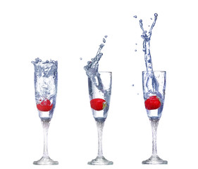 collage  Strawberry splash in a cocktail glass on white