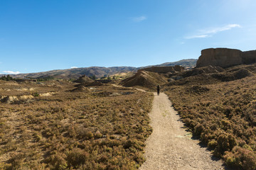 tourist walking on canyon land at Bannockburn