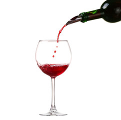 Wine collection - Splashing red wine in a glass. Isolated on white background and pourer