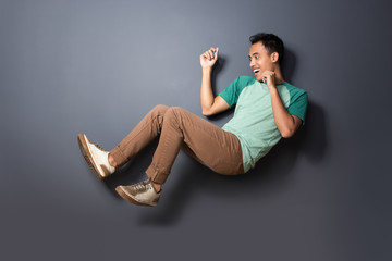 young man floating and act like fall over