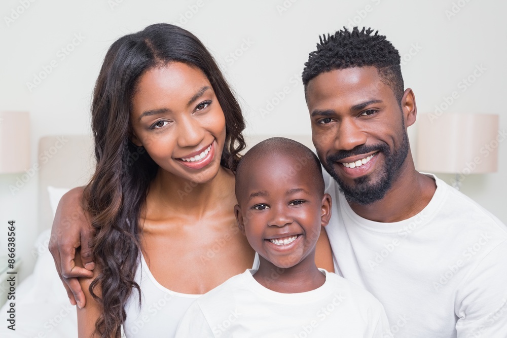 Wall mural Happy family smiling at camera