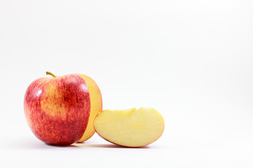 Apple fruit with a cut isolated on white.