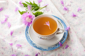 Obraz na płótnie Canvas Cornflower tea with simple cornflower