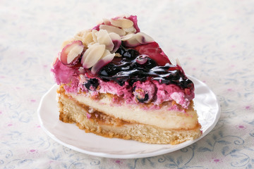 Raspberry and currant cheesecake on tablecloth