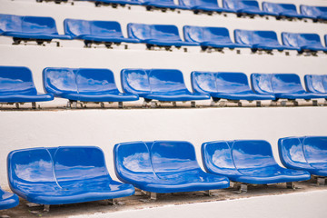 blue seats for sports fanclub on the stadium