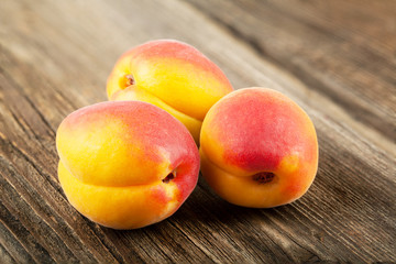 Ripe apricot on a wooden
