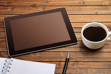 Fototapeta na wymiar Tablet empty screen with coffee cup
