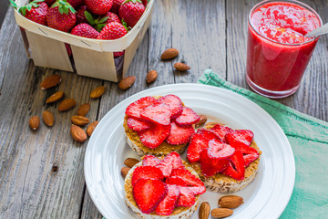 healthy snack small loafs with peanut butter and fresh strawberr