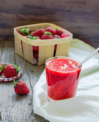 strawberry smoothie in a glass of fresh strawberries, rustic,  s