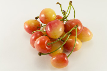 Handful of red and yellow sweet cherries