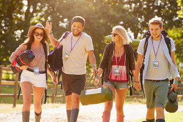 Obraz premium Group Of Young People Going Camping At Music Festival