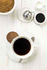 cup of tea with milk  sugar and cookie