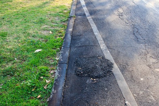 Poorly Patched Pavement.